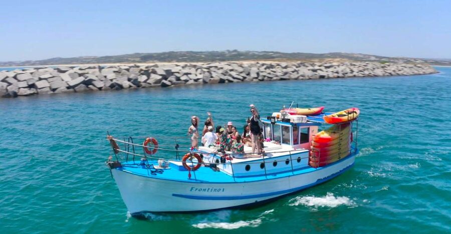 Alvor: Explore Caves Boat and Kayak Tour - Cruising from Alvor toward Praia do Vau
