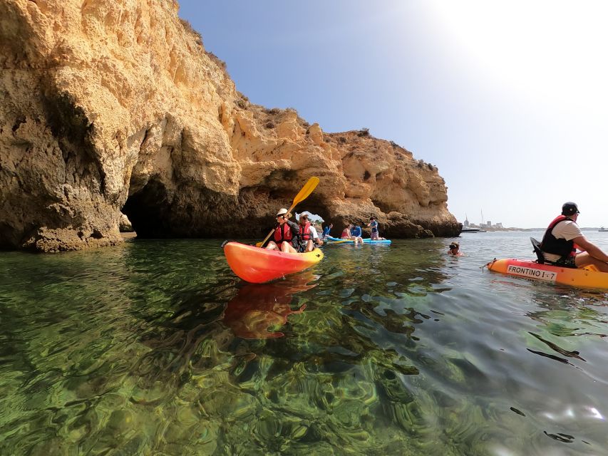 Alvor: Explore Caves Boat and Kayak Tour - Paddling into caves and coastal arches
