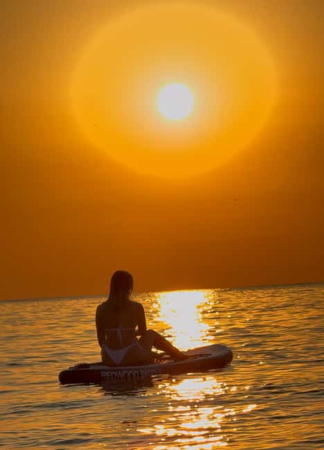 BARCELONA PADDLE SURF SUNRISE+BREAKFAST+PHOTOSVIDEOS4K+GUIDE - Getting ready with a wetsuit, board, and guide