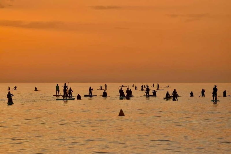 Barcelona: Paddleboarding at Sunrise. Includes: instructor, photos, equipment - Walking to the water as Barcelona wakes up