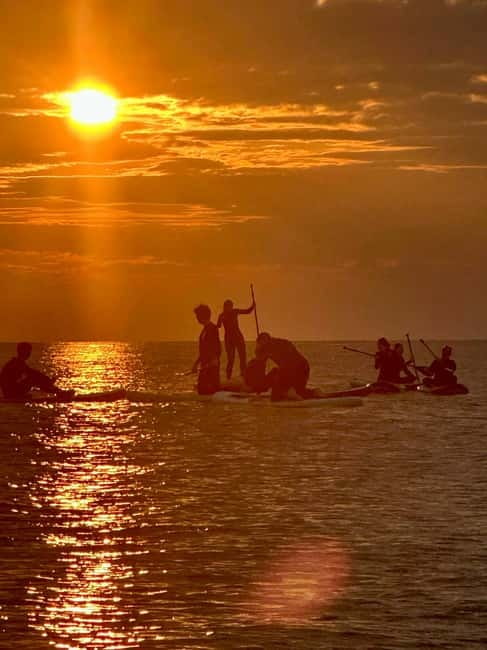 Barcelona: Paddleboarding at Sunrise. Includes: instructor, photos, equipment - Watching the sunrise from a paddleboard