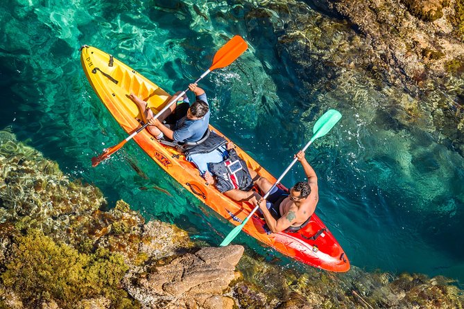 Costa Brava Kayaking and Snorkeling Small Group Tour with Lunch - Kayaking through cliffs and coves