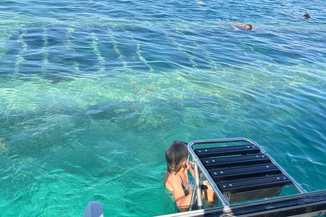 Day Lagoon 100% Sailing stops Snorkelling Paddle - Taking the helm with Captain Xavier