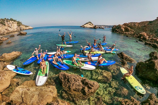 Discover the best corners of the island in paddle surf - Paddling past cliffs and coastal caves