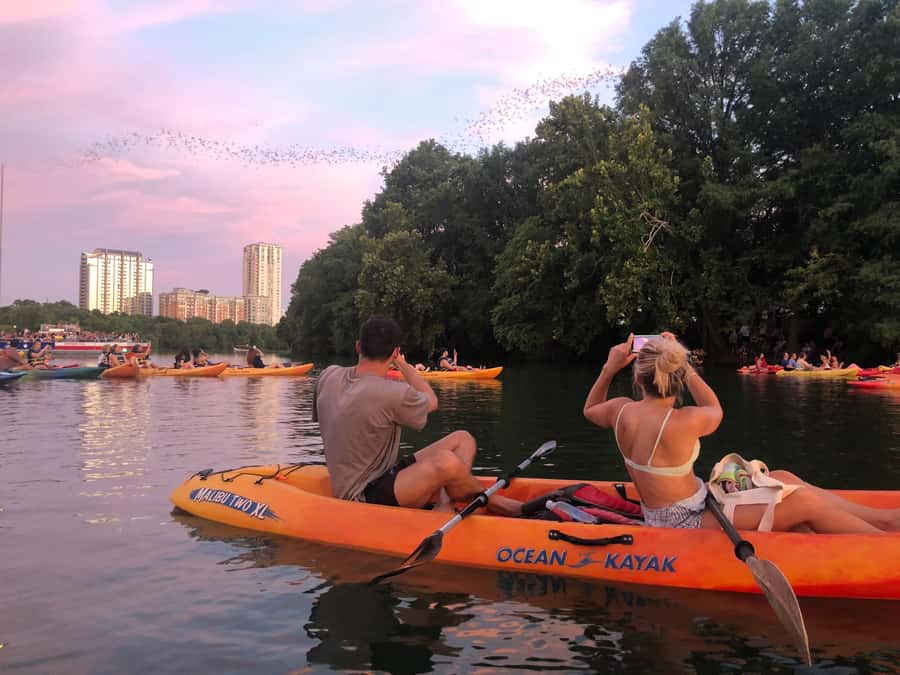 Downtown Sunset Tandem Kayak with 1.5M Bats - The sunset pause over the water