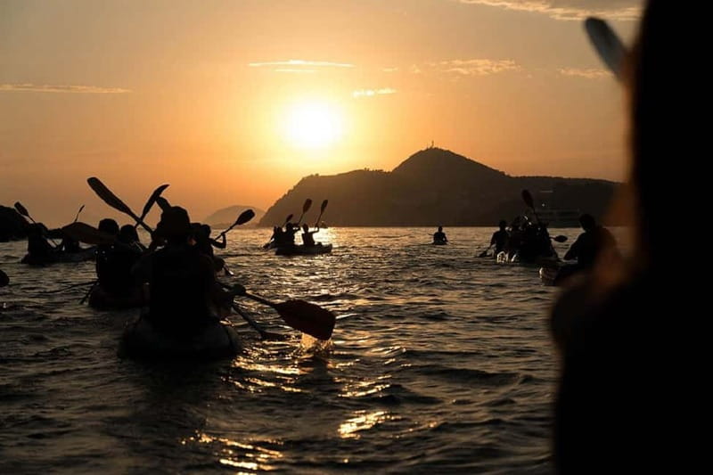 Dubrovnik: Guided Sunset Sea Kayaking Tour with Wine - Paddling below Dubrovnik’s Old Town walls