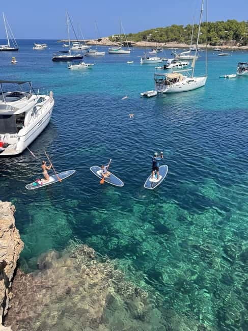 Experience Crystal paddle surf Tours + snorkel - Why the transparent paddleboard matters at Cala Llonga