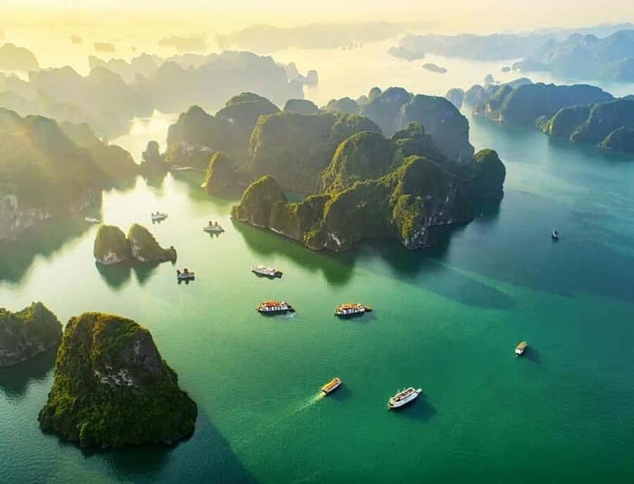 From Hanoi: Ha Long Bay Luxury Day Cruise with Food & Kayak - Sailing past Ha Long Bay’s famous limestone islets