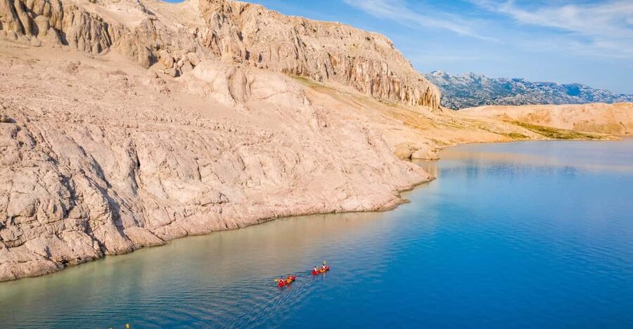 From Metajna/Novalja: Pag Bay Guided Sea Kayaking Tour - Sušac Cape gives you the first proper swim