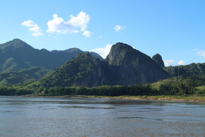 FULL DAY – Kuang Si Waterfall, Kayak on the Nam Ou / Mekong River, Pak Ou Caves - Whisky Village and the road to Kuang Si