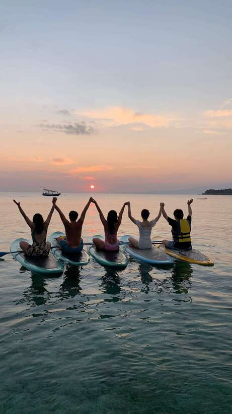 gili sunrise Stand-up paddle boarding or kayaking (droneshot - Looking for turtles around the Gili islands