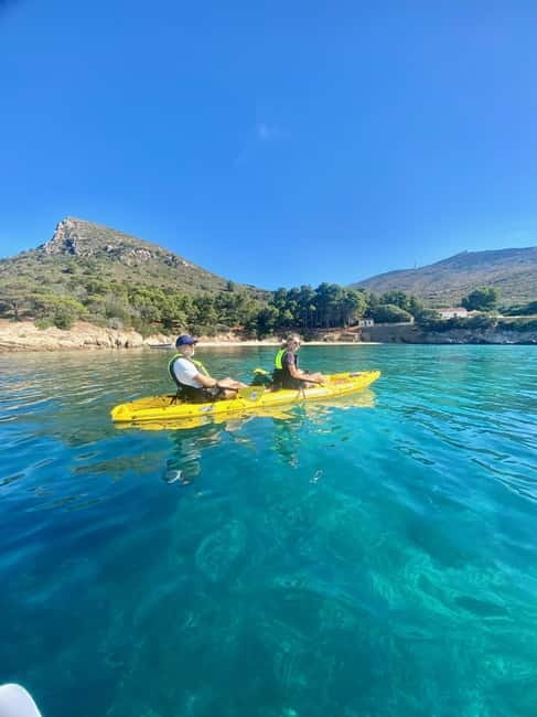 Golfo Aranci:Small group, german guided Kayak tour&Dolphins - Figarolo Island, swimming, and local food