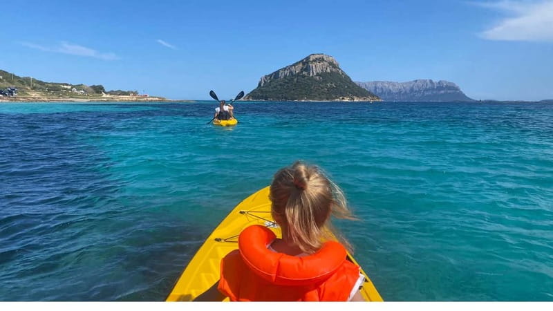 Golfo Aranci:Small group, german guided Kayak tour&Dolphins - Meeting the yellow kayaks at Spiaggia dei Baracconi