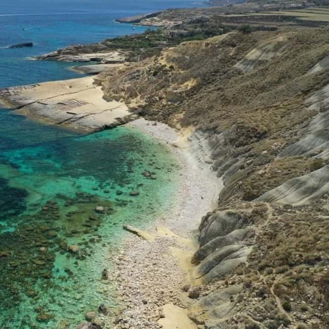 Gozo: 1 Hour Kayak plus +Cave Tour + Drop off Blue Lagoon - Starting under the yellow umbrella at Hondoq Bay
