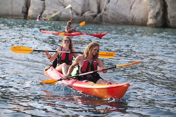 Half-Day Split Sea Kayak Adventure - Paddling beside the cliffs and beaches