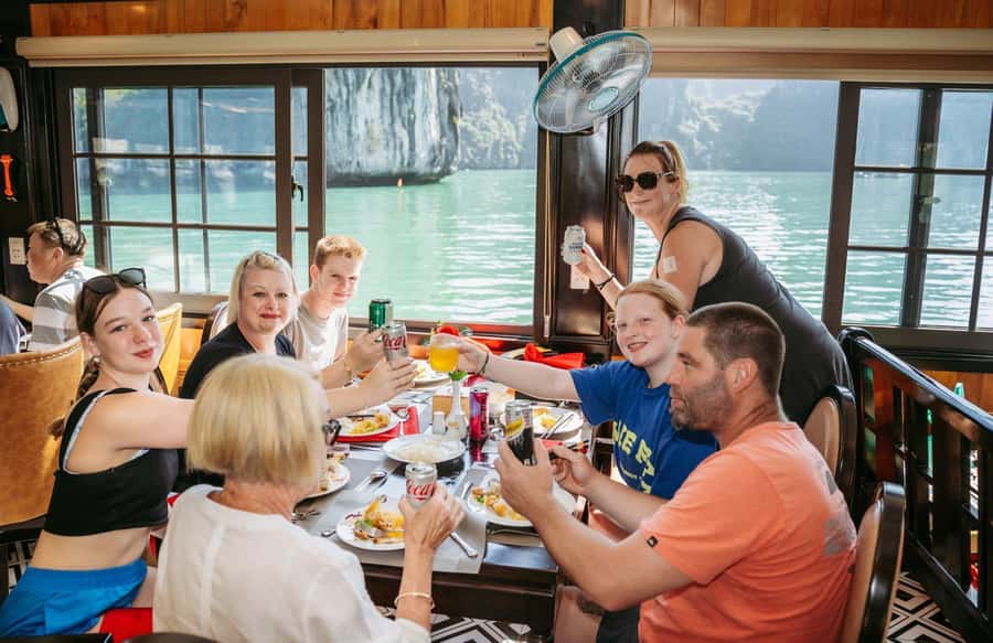 Halong Bay: Day Cruise with Caves, Kayaking & Sunset Party - Titop Island for swimming or a summit view