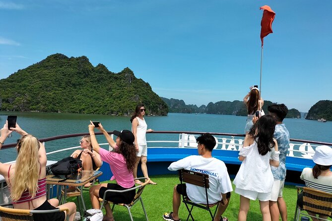 Halong Bay Day Tour With Titop Island, Cave, Kayak & Lunch - Luon Cave by kayak or bamboo boat