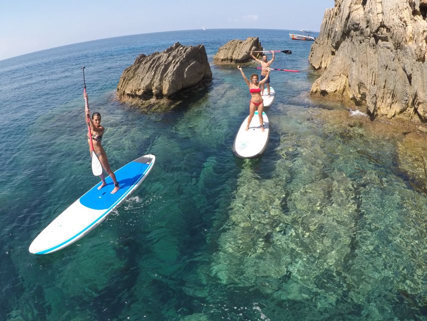 Ibiza: SUP & Snorkel Boat Tour with Caves, Drinks & Photos - Paddling through coves and natural caves