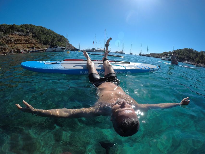 Ibiza: SUP & Snorkel Boat Tour with Caves, Drinks & Photos - Fruit, tapas, and a relaxed boat break