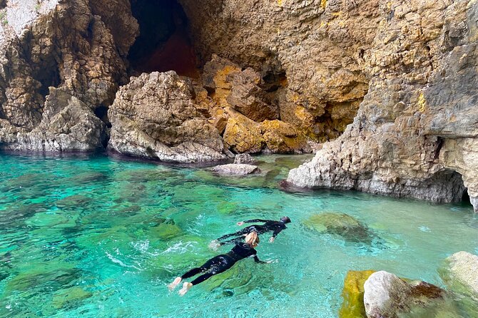 Kayak Paradise: Cala Portixol Snorkel, Cave & Cliff Jumping Tour - Isla de Portixol and the blue lagoon