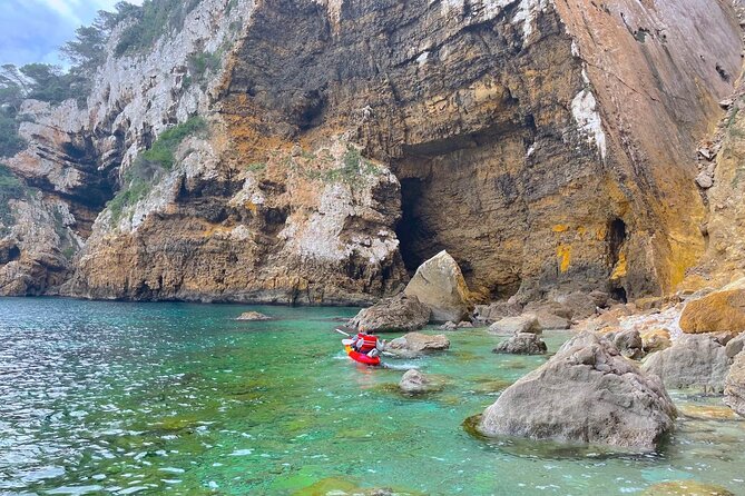 Kayak Paradise: Cala Portixol Snorkel, Cave & Cliff Jumping Tour - Guides, pacing, and the family experience