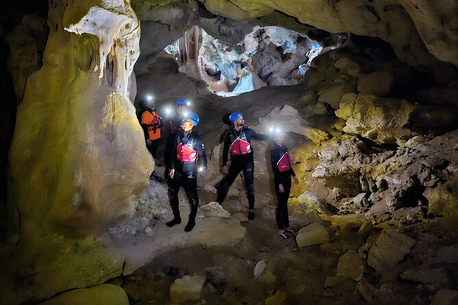 Kayak through Morro de Toix and Cueva dels Coloms - Entering Cueva dels Coloms with a helmet and headlamp