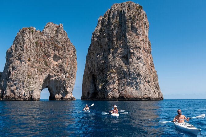 Kayak tour in Capri between caves and beaches. Photos included. - Meeting the Faraglioni from sea level