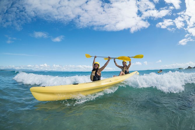 Kayaking with Dolphins in Byron Bay Guided Tour - Riding waves near the beach