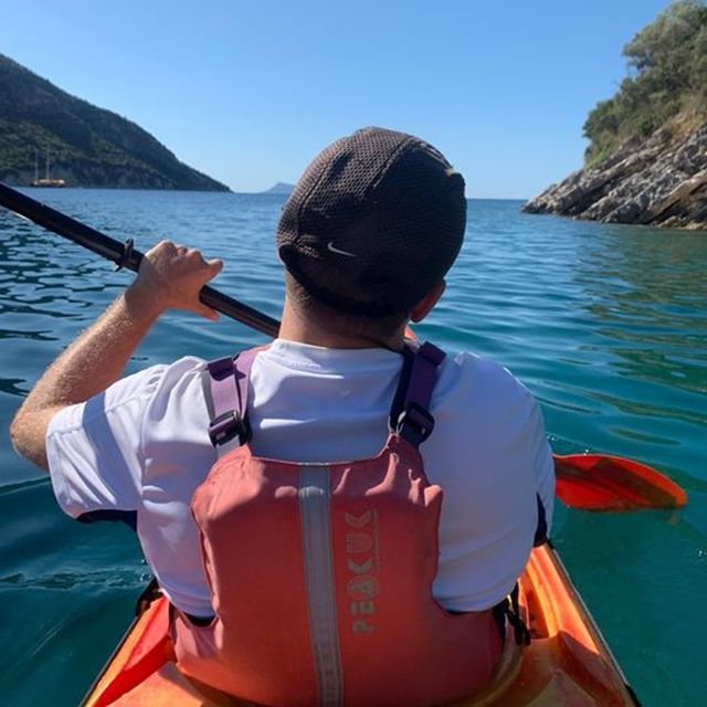 Lefkada: Hidden Blue Cave Kayak Trip with Lunch & Fruits - Snorkeling above large red sea stars