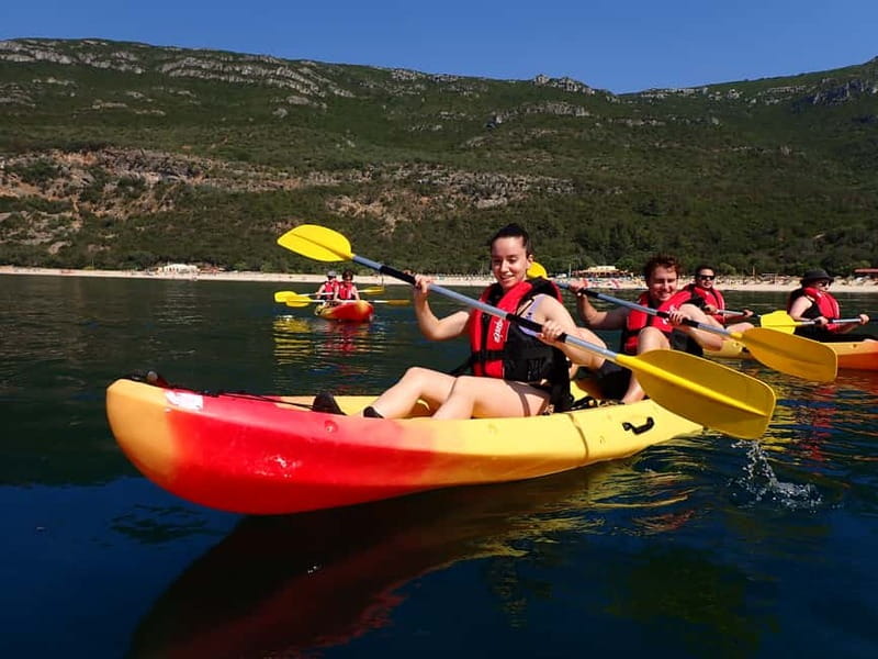 Lisbon: Kayaking & Snorkeling Tour with photos included - Paddling beneath Arrabida’s sea cliffs