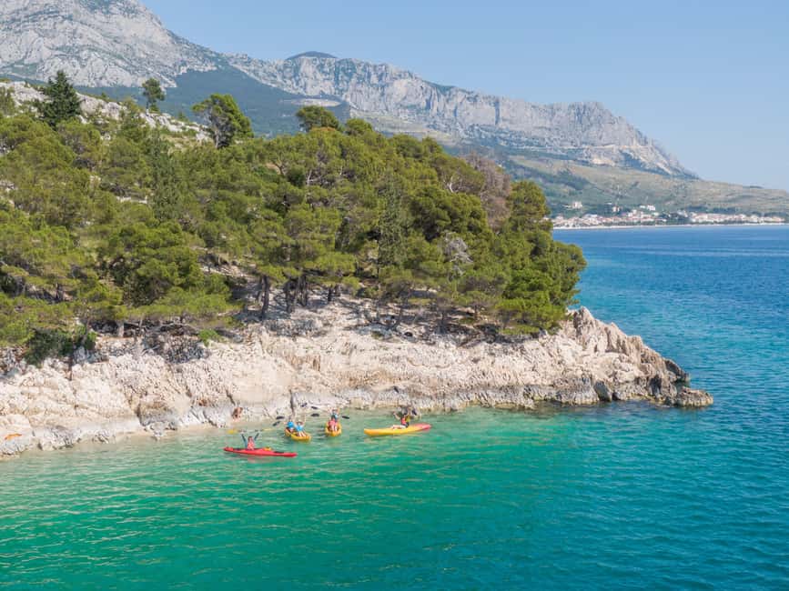 Makarska: Guided Sea Kayaking Tour with Snorkeling Stop - Paddling east with Makarska behind you