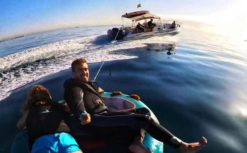 Mallorca: Private Watersports Boat. LUNCH Drinks SUP, Tubing - Cala Vinyes, Cap Falcó, and the open-water ride