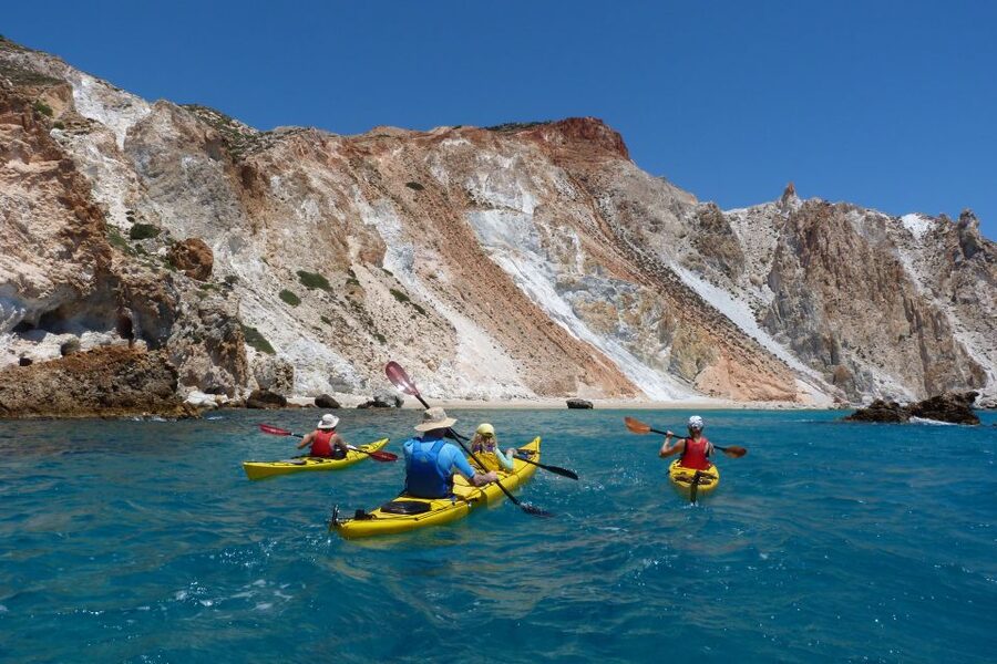 Milos: Guided Kayaking Trip with Snorkelling & Lunch - The first beach stop: swimming, snorkeling, and fruit