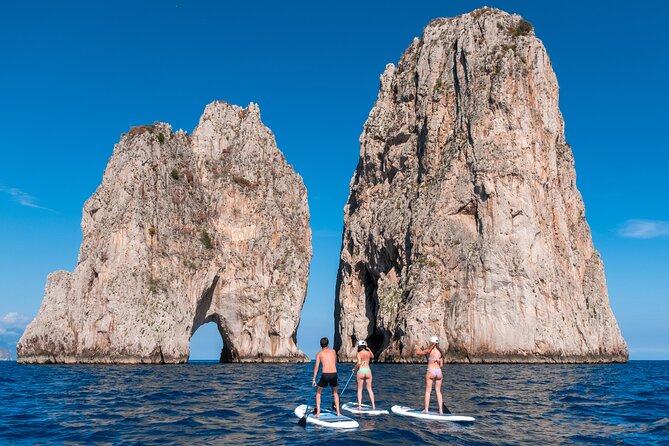 Paddleboard in Capri between caves and beaches. Photos included! - Faraglioni photographs and a swim in Capri’s blue water