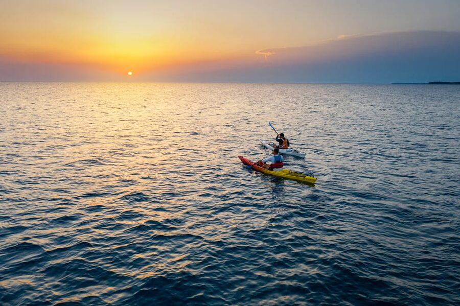 Poreč: Sea Kayaking Sunset Tour - A Swimming and Refreshment Break