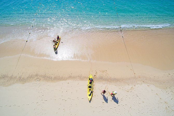 Private Glass bottom Kayak and snorkel at two Bays - Santa María Beach: launching the glass-bottom kayak