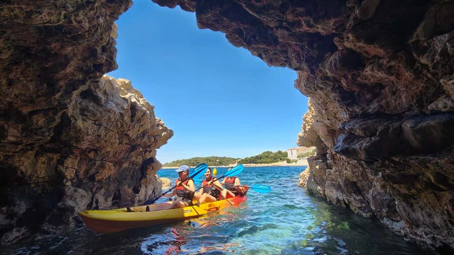 Pula: Cave Kayak Tour, Snorkeling and Island Jumping - Starting at Ambrela Beach with a short kayak lesson