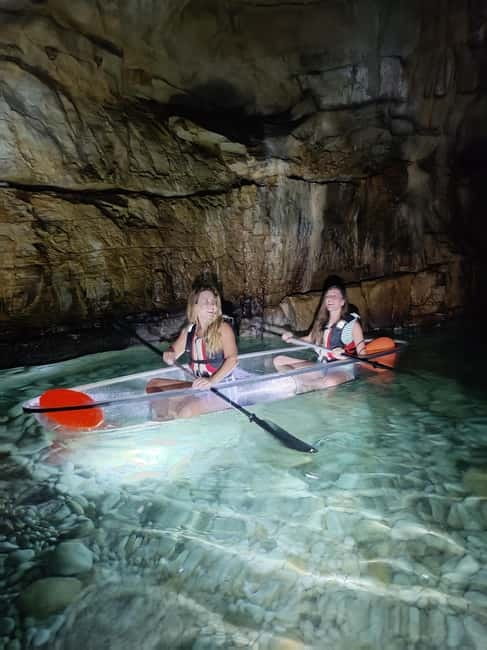 Pula: Cave Sunset/Night Tour in Transparent Kayak - Looking through the illuminated kayak