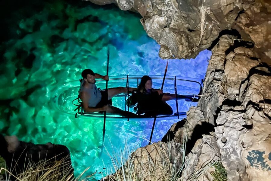 Pula: Night-Time Sea Kayaking Tour in Transparent Kayak - Looking through the LED-lit kayak