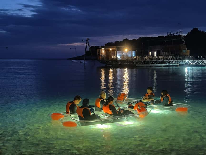 Pula: Night Tour in Transparent Kayak with Stargazing - A rocky beach beneath the stars