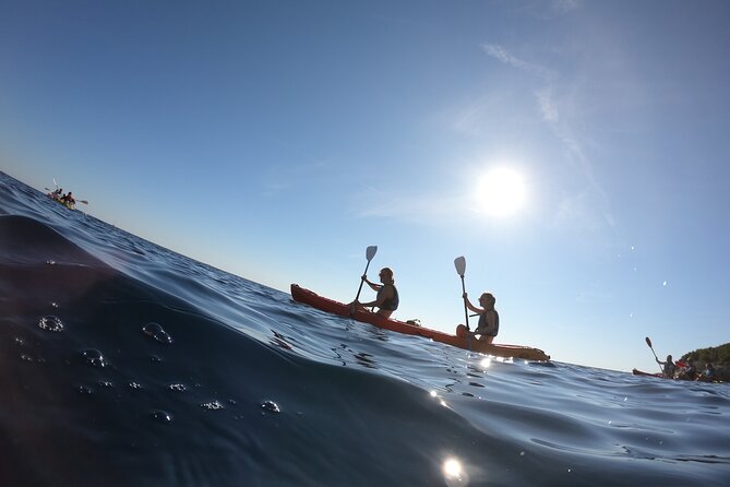 Pula: Sunset Adventure – Boat, Kayak, Snorkeling & Sunset - Paddling past Muzil’s high cliffs