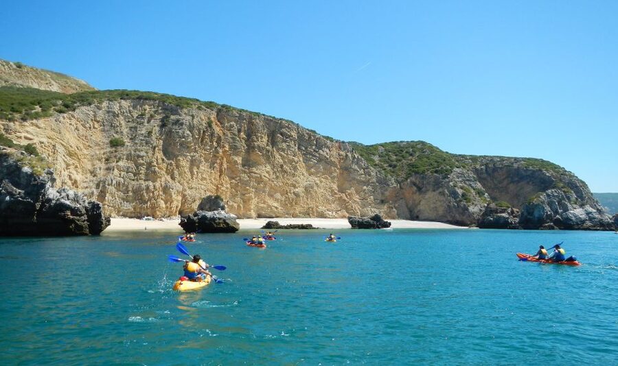 Sesimbra: Arrábida Natural Park Guided Kayaking Tour - Paddling toward the cliffs and caves