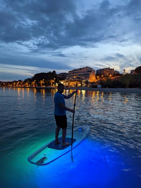 Split: Transparent SUP night Glow tour - Returning along the illuminated shoreline