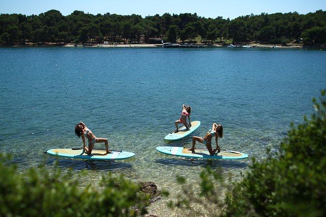 SUP Yoga in Pula: Flow on Water - Reaching the anchored boards