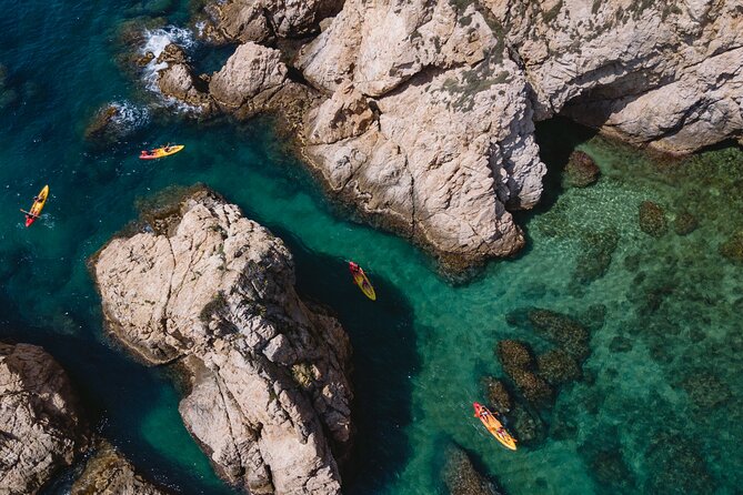 Tossa de Mar: Kayak & Snorkel Tour with Paella from Barcelona - Paddling past cliffs, coves, and sea caves