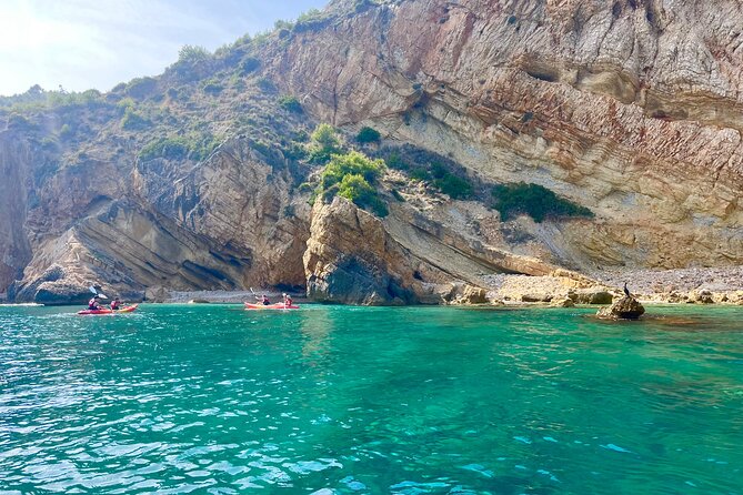 Uncharted Marine Reserve Cave, Snorkel & Cliff Jumping Kayak Tour - Cliff jumping at Cala Tango